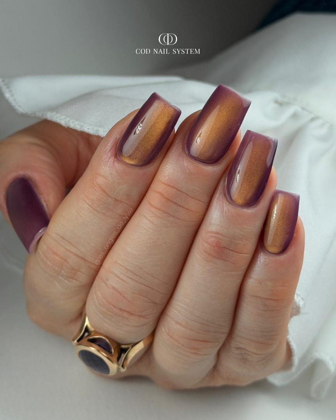 Pose d'ongles carrée cat eyes violine et orange Pose d'ongles carrée cat eyes violine et orange